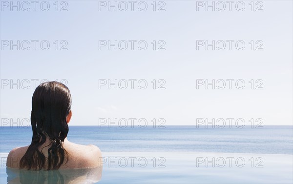 Woman in swimming pool, US Virgin Islands, USA, St. John, United States Virgin Islands, USA