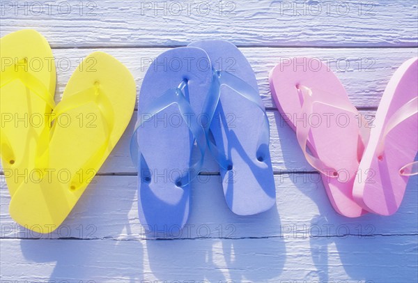 USA, Virgin Islands, St. John, Overhead view of colorful flip flops on deck, St. John, United States Virgin Islands, USA