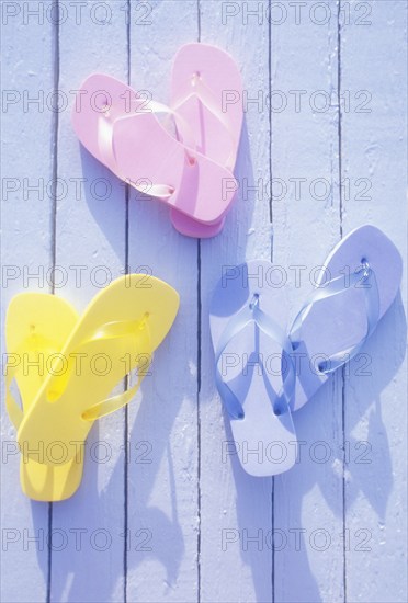 USA, Virgin Islands, St. John, Overhead view of colorful flip flops on deck, St. John, United States Virgin Islands, USA