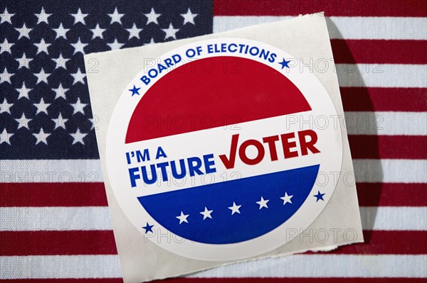 Future voter sticker on American flag, New York, New York, USA