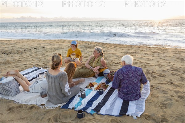 Mexico, Baja, Pescadero, Three generation family having picnic on beach, Pescadero, Baja, Mexcio