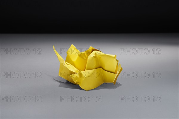 Studio shot of yellow crumpled paper, Austin, Texas, USA