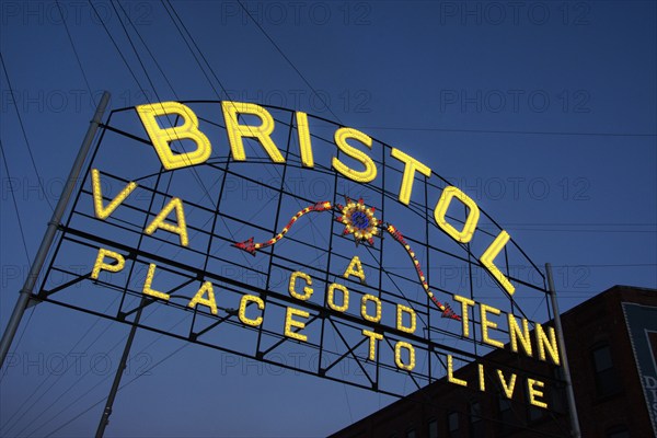 USA, Virginia, Bristol, Low angle view of Bristol sign over State Street against sky at dusk, Bristol, Virginia, USA