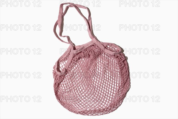 USA, New York State, New York City, Pink mesh tote bag on white background, New York City, New York, USA