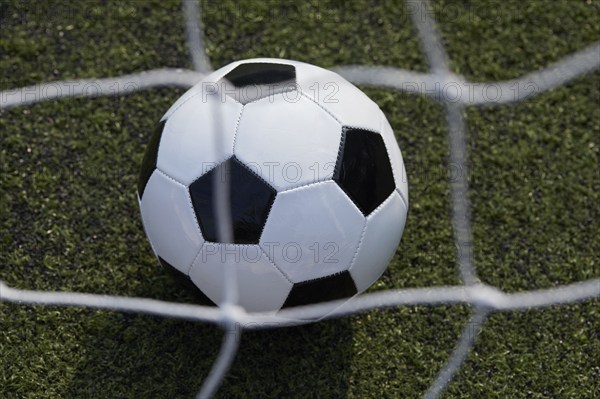 USA, New York State, New York City, Close-up of soccer ball on turf field, New York City, New York, USA