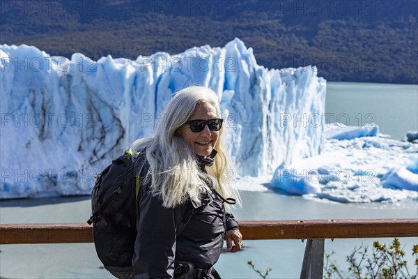 Argentina, Santa Cruz, El Calafate, Portrait of woman at Perito Moreno glacier ice formations, El Calafate, Santa Cruz, Argentina