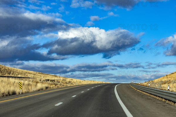 Cumulus clouds over Interstate 80, Elko, Nevada, USA