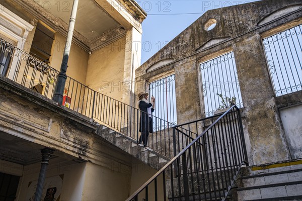 Woman photographing old buildings, Buenos Aires, , Argentina