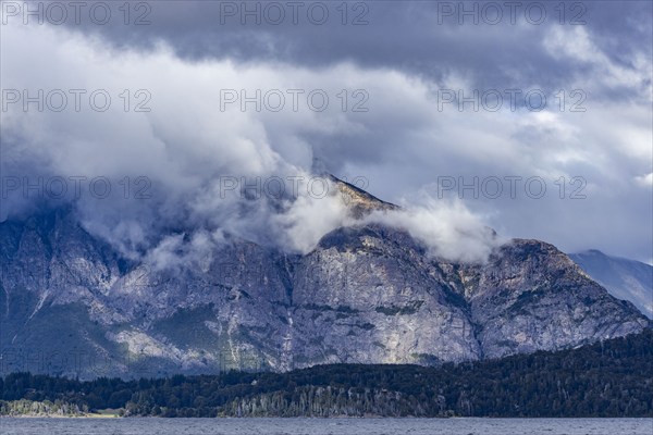 Low clouds covering rugged shoreline of Lake Nahuel Huapi, Bariloche, Rio Negro, Argentina