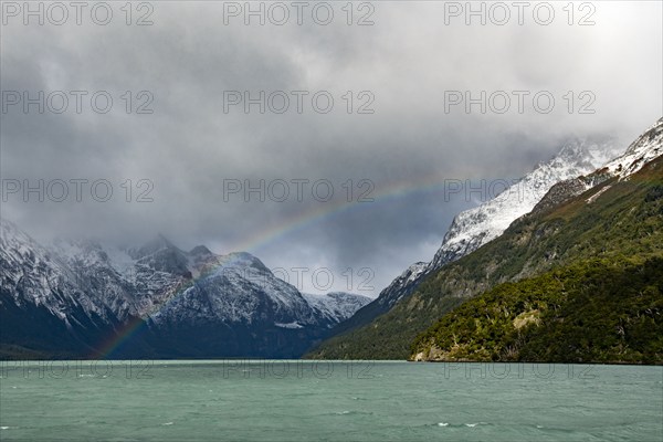 Argentina, Santa Cruz, El Calafate, Rainbow and clouds over lake at Perito Moreno Glacier, El Calafate, Santa Cruz, Argentina