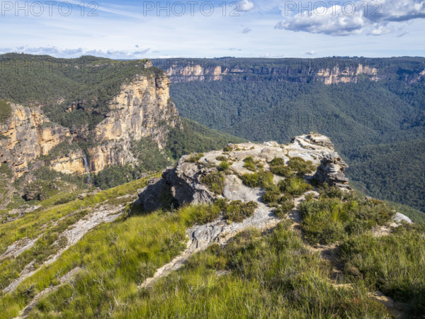 Rocky mountains with waterfall in distance
Blackheath, New South Wales, Australia