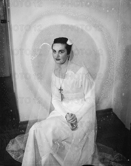 Georgina Fowler. Portrait shot of Georgina Fowler seated, wearing a wedding dress. Kenya, 16 November 1954. Kenya, Eastern Africa, Africa.