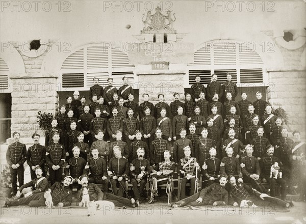 G.H. Gough's Troop. Portrait of a British regiment of the Indian Army in uniform. A sign within the photograph indicates that the group are 'Capt. Bt. Lt. Col. The Hon. G.H. Gough's Troop'. India, 1885. India, Southern Asia, Asia.