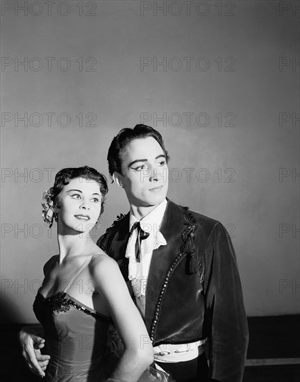 Daphne Dale and Nicholas Polajenko. Dancers Daphne Dale and Nicholas Polajenko, wearing theatrical costume and make up, pause for a moment during a ballet routine. Kenya, 28 October 1955. Kenya, Eastern Africa, Africa.