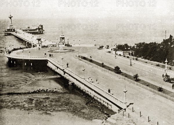 The pier at Cape Town. The pier at Cape Town dotted with pedestrians and the occasional horse-drawn carriage. Cape Town, Cape Province (West Cape), South Africa, 22-29 December 1923. Cape Town, West Cape, South Africa, Southern Africa, Africa.