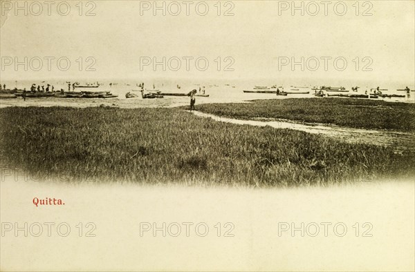 Boats at Quitta, Gold Coast. Fishing vessels at sea off the coast at Quitta. Quitta, Gold Coast (Ghana), circa 1920. Quitta, West (Ghana), Ghana, Western Africa, Africa.