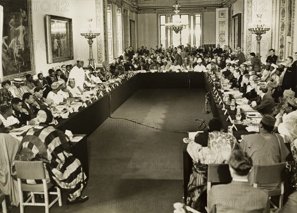 The 1957 Lancaster House Conference. Dr Nnamdi Azikiwe, Premier of Eastern Nigeria, addresses a room full of British and Nigerian delegates at the 1957 Lancaster House Conference, one of two meetings where the federal constitution for an independent Nigeria was prepared. London, England, 1957. London, London, City of, England (United Kingdom), Western Europe, Europe .