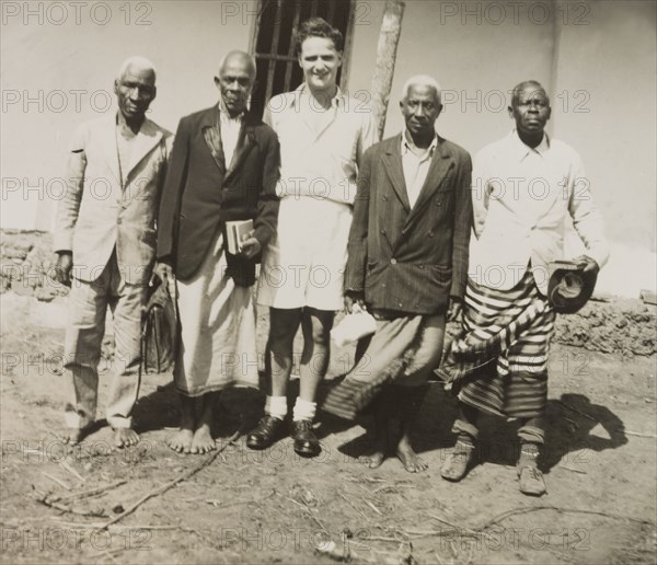 An English missionary with African priests. English Methodist missionary, Reverend Ian Lewis (centre), poses for a group portrait with several African priests. Left to right they are identified as: Reverend Joseph Jara, Padre Simeon Ubo, Padre Benjimin Ndumari and Padre Isaya Obadiah. Coast Province, Kenya 1951., Coast, Kenya, Eastern Africa, Africa.