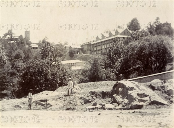 Captain Blount in Murree. British colonial officer, Captain Blount, is pictured against the backdrop of his home town. Murree, Punjab, India (Punjab, Pakistan), 1896. Murree, Punjab, Pakistan, Southern Asia, Asia.