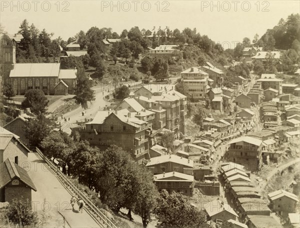 View over Murree, Pakistan. Hilltop view over Murree, showing the awnings and crowds of a busy market stretching into the distance along a winding road. Murree, Punjab, India (Punjab, Pakistan), 1898. Murree, Punjab, Pakistan, Southern Asia, Asia.