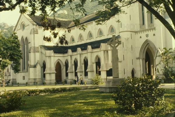 St John's Cathedral, Hong Kong. View from a leafy churchyard of St John's Cathedral. Hong Kong, People's Republic of China, August 1960. Hong Kong, Hong Kong, China, People's Republic of, Eastern Asia, Asia.