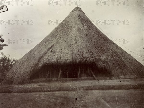 Tomb of Mutesa I. Exterior view of the thatched tomb of Mukaabya (c.1837-1884). Better known by his royal title of Mutesa I, he was Kabaka (King) of Buganda from 1856 until his death in 1884. Near Kampala, Uganda, 1906., Central (Uganda), Uganda, Eastern Africa, Africa.