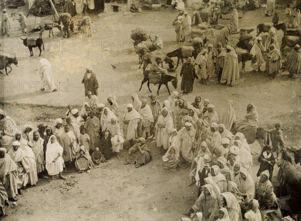 Storytelling at Safi. A 'halca' (audience) of Moroccan locals forms a large open circle for a 'halaqui' (storyteller), a performance space for him to recite his traditional tales. Safi, Morocco, 1898. Safi, Safi, Morocco, Northern Africa, Africa.