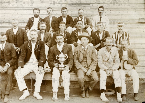 Premier Diamond Mine cricket team. Cricket team of the Premier Diamond Mine. The man in the striped blazer and peak cap on the far right of the group is identified on reverse as 'R.A. Rice'. South Africa, 1907. South Africa, Southern Africa, Africa.