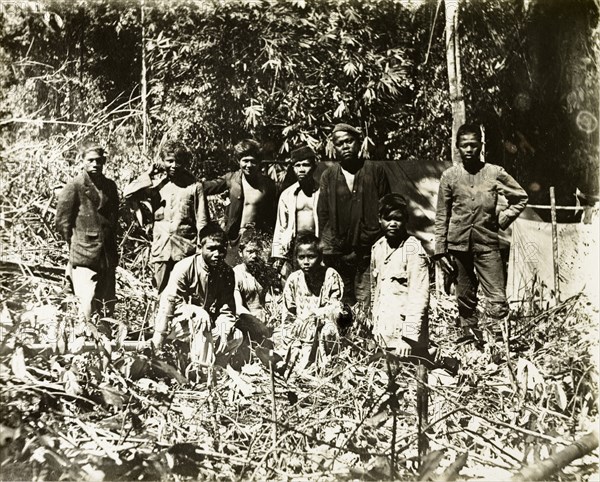 Malay assistant surveyors and porters. Malay assistant surveyors and porters from a British-led trigonometrical survey at Gunung Gerah (2103 m.) on the border between Perak and Kelantan. Perak, British Malaya (Malaysia), 1905., Perak, Malaysia, South East Asia, Asia.