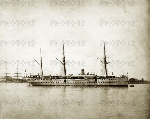 RIMS 'Elphinstone'. RIMS 'Elphinstone', a naval steamer belonging to the Royal Indian Marine Service, in anchorage at a harbour. Indian Ocean, circa 1895., Southern Asia, Asia.