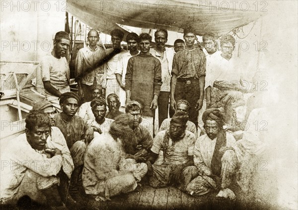 Survivors of the crew from SS Aden. Members of the Asian crew from SS Aden pictured on the deck of a ship following their rescue from Socotra. Indian Ocean near Socotra, Yemen, June 1897. Socotra, Adan, Yemen, Middle East, Asia.