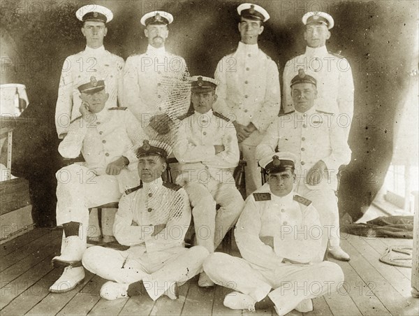 Officers aboard RIMS 'Investigator'. Group portrait of nine uniformed officers posed on the deck of RIMS 'Investigator'. Indian Ocean, circa 1900., Southern Asia, Asia.