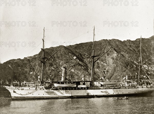 HMS 'Alert'. HMS 'Alert', a naval steamer belonging to the Persian Gulf Operations Fleet, floats off shore. Probably the Persian Gulf, circa 1900., Middle East, Asia.