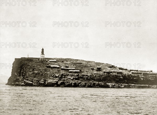 Little Quoin Island, Persian Gulf. View of a headland on Little Quoin Island, taken from a naval ship near to the entrance of the Persian Gulf. Gulf of Oman, Oman, circa 1900. Oman, Middle East, Asia.