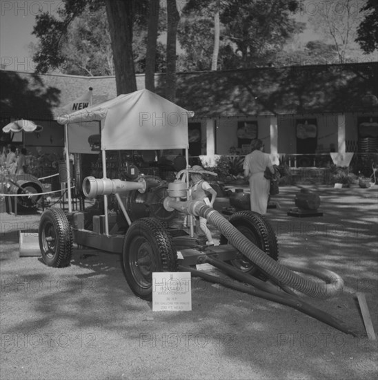 A Lister Sigmund Portable Irrigation Pump. A Lister Sigmund Portable Irrigation Pump is displayed on a lawn at the Gailey & Roberts stand at the Royal Show. Kenya, 25 September 1957. Kenya, Eastern Africa, Africa.