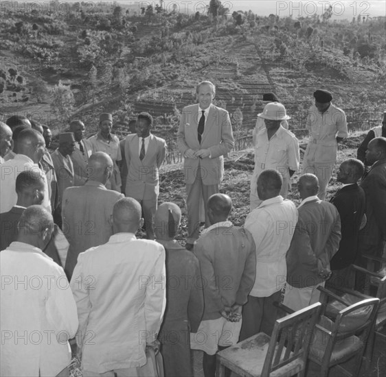 Lennox-Boyd visits Fort Hall. Alan Tindal Lennox-Boyd (1904-1983) meets Kenyan elders of the Fort Hall district, guided by Chief Ignatio who stands by his side wearing a solatopi hat. Fort Hall, Kenya, 15 October 1957., Central (Kenya), Kenya, Eastern Africa, Africa.