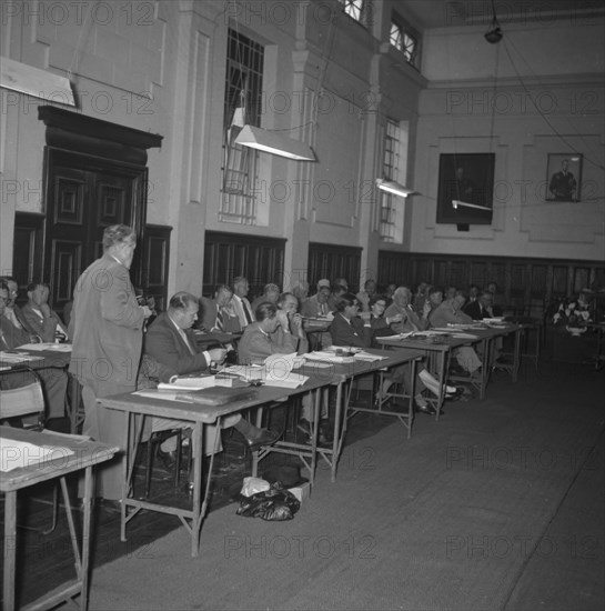 KNFU conference. Members of the Kenyan National Farmer's Union (KNFU) sit behind desks, taking notes at a KNFU conference attended by Sir Michael Blundell. Kenya, 5 November 1957. Kenya, Eastern Africa, Africa.