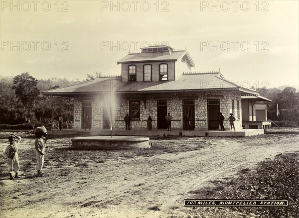 Montpelier railway station. A fountain brightens up the patch of rough ground outside Montpelier railway station. Montpelier, Jamaica, circa 1895. Montpelier, St James (Jamaica), Jamaica, Caribbean, North America .