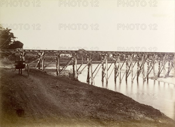 Port Antonio extension line. A narrow trestle bridge carries the Port Antonio railway extension line across a river. Portland, Jamaica, circa 1895., Portland, Jamaica, Caribbean, North America .