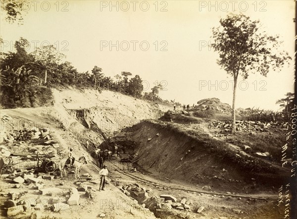 Railway construction site. Labourers at work on a construction site, landscaping a bank of earth to accomodate a new railway track. Jamaica, circa 1895. Jamaica, Caribbean, North America .