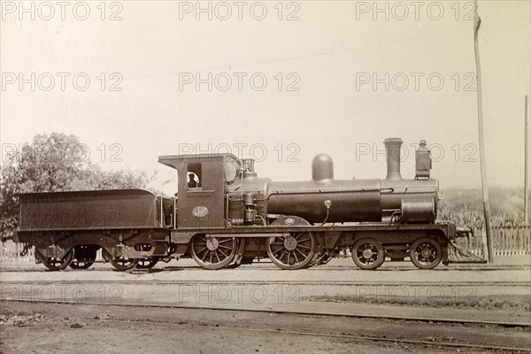 British steam locomotive. No. 10', a British-manufactured steam locomotive sits on rails at a siding. Jamaica, circa 1895. Jamaica, Caribbean, North America .