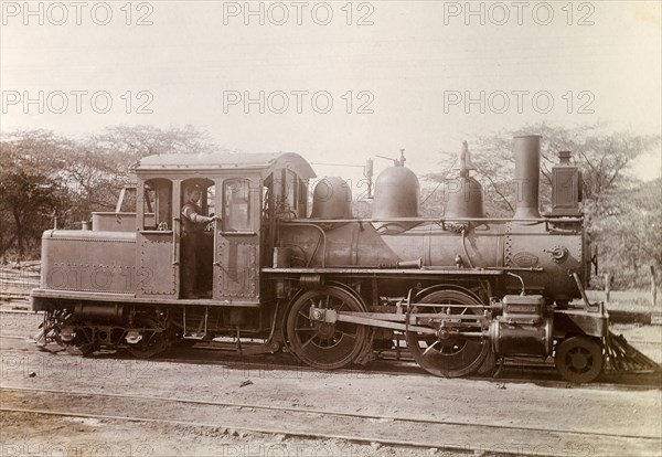 American steam locomotive. An American-manufactured steam locomotive sits on rails at a siding. A plaque on its side reads: 'Rhode Island Locomotive Works. Builders No.2855. Providence'. Jamaica, circa 1895. Jamaica, Caribbean, North America .