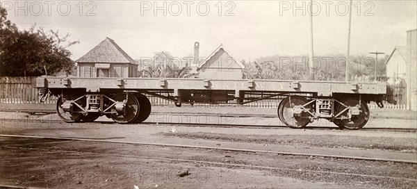 Jamaica Railway wagon. An open railway wagon sits on rails at a siding. Jamaica, circa 1895. Jamaica, Caribbean, North America .