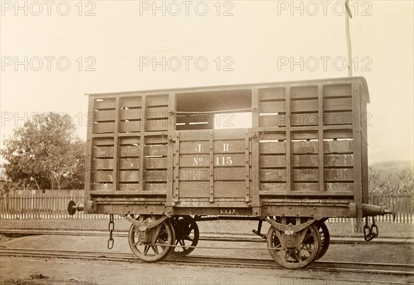 Jamaica Railway wagon. A railway wagon inscribed 'J. R. No.115', sits on rails at a siding. Jamaica, circa 1895. Jamaica, Caribbean, North America .