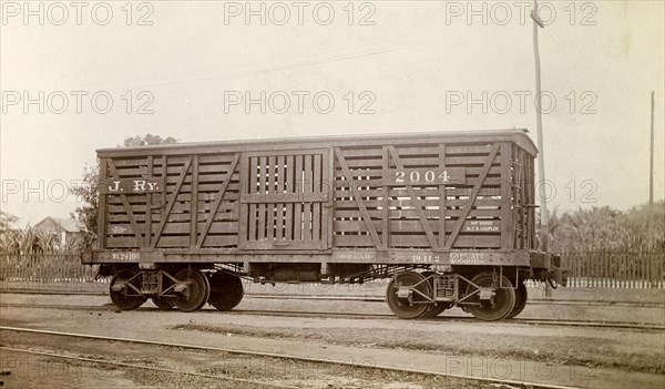 Jamaica Railway wagon. A closed railway wagon inscribed 'J. RY.2004', sits on rails at a siding. Jamaica, circa 1895. Jamaica, Caribbean, North America .