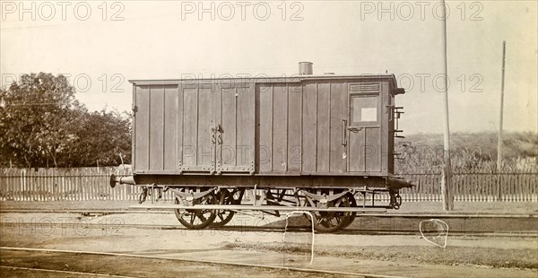 Jamaica Railway wagon. A closed railway wagon sits on rails at a siding. Jamaica, circa 1895. Jamaica, Caribbean, North America .