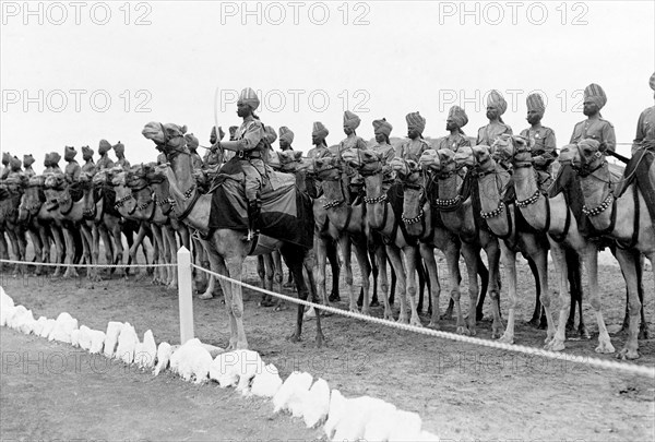 Royal camel escort at Aden. An Indian Army camel escort for King George V and Queen Mary. The royal couple stopped at Aden during their outward journey to India for the Coronation Durbar at Delhi. Aden, Yemen, circa 27 November 1911. Aden, Adan, Yemen, Middle East, Asia.