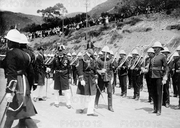 Guard of Honour for the Duke of Connaught. The Duke of Connaught inspects a Royal Guard of Honour as they present arms, watched by a crowd of spectators. This was one of several stops made by the Duke following his official visit to Cape Town to open the new Union Parliament. Bloemfontein, Orange Free State (Free State), South Africa, 9-11 November 1910. Bloemfontein, Free State, South Africa, Southern Africa, Africa.