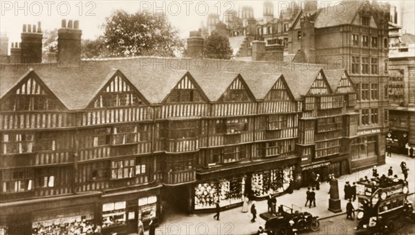 Half-timbered houses, London. A terrace of half-timbered houses, built during the Tudor period, flank a city street in Holborn. London, England, circa 1910. London, London, City of, England (United Kingdom), Western Europe, Europe .