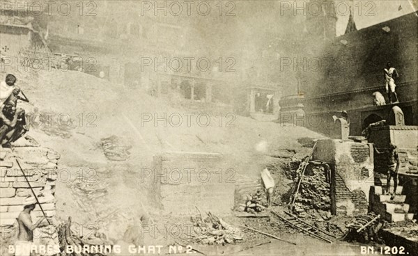 A cremation ghat in Benares. Smoke obscures the view of a cremation ghat (stepped wharf) on the River Ganges at Benares, one of Hinduism's holiest sites. Benares, North Western Provinces (Varanasi, Uttar Pradesh), India, circa 1870. Varanasi, Uttar Pradesh, India, Southern Asia, Asia.